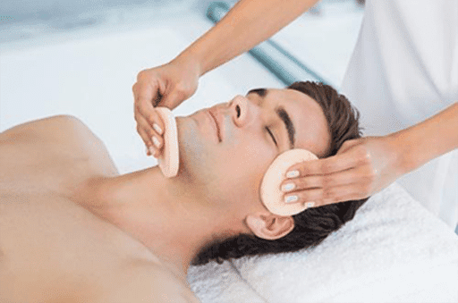 Relaxed man getting facial microdermabrasion